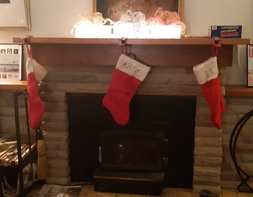 three red stockings hung by a chimney with care